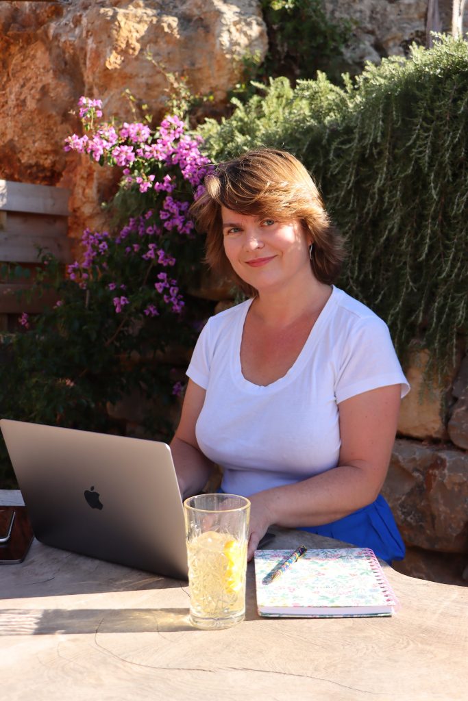 michaela-virtual-assistant-working-remotely-in-lagos-with-laptop-macbook